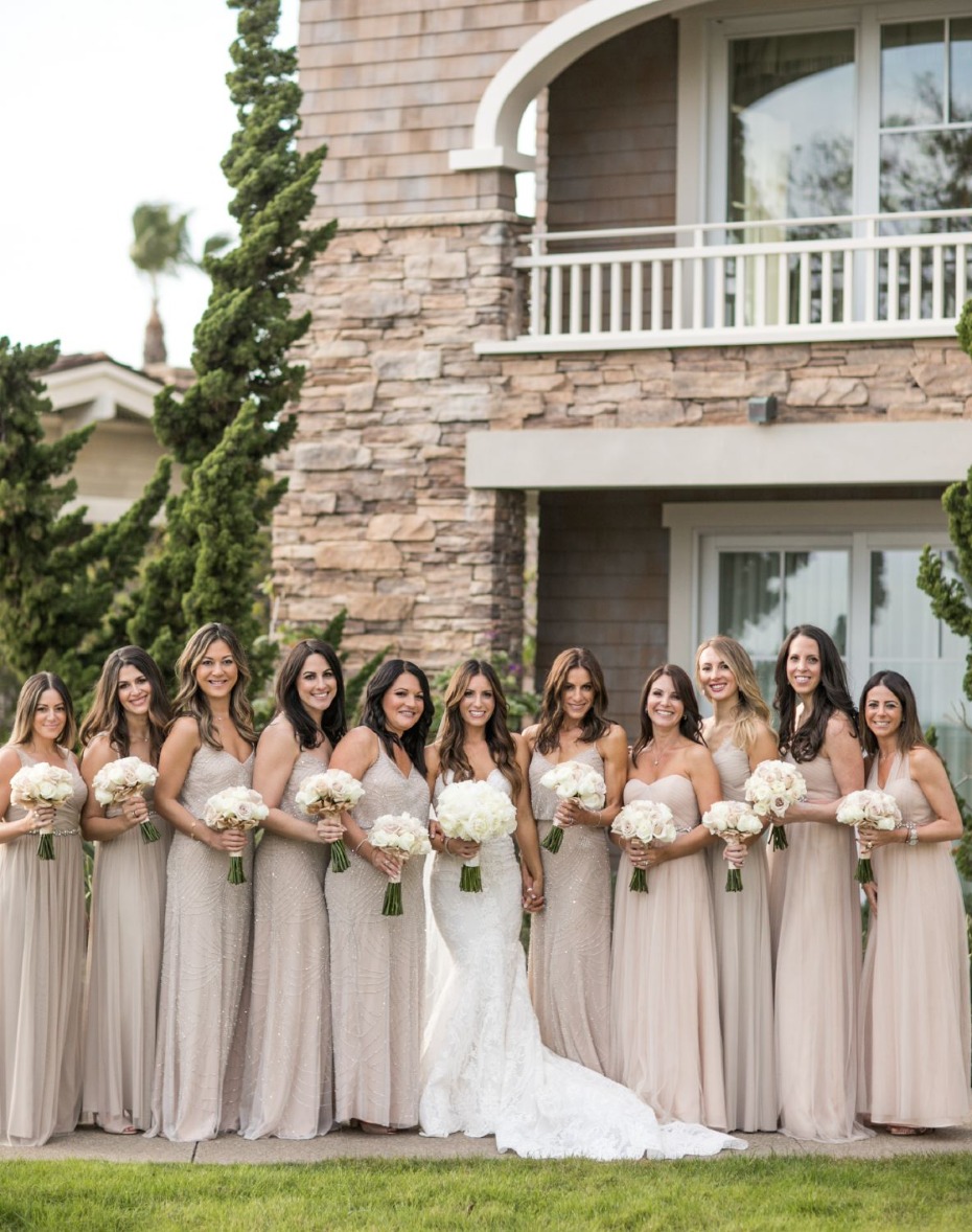 bride and her bridesmaids in neutral dresses