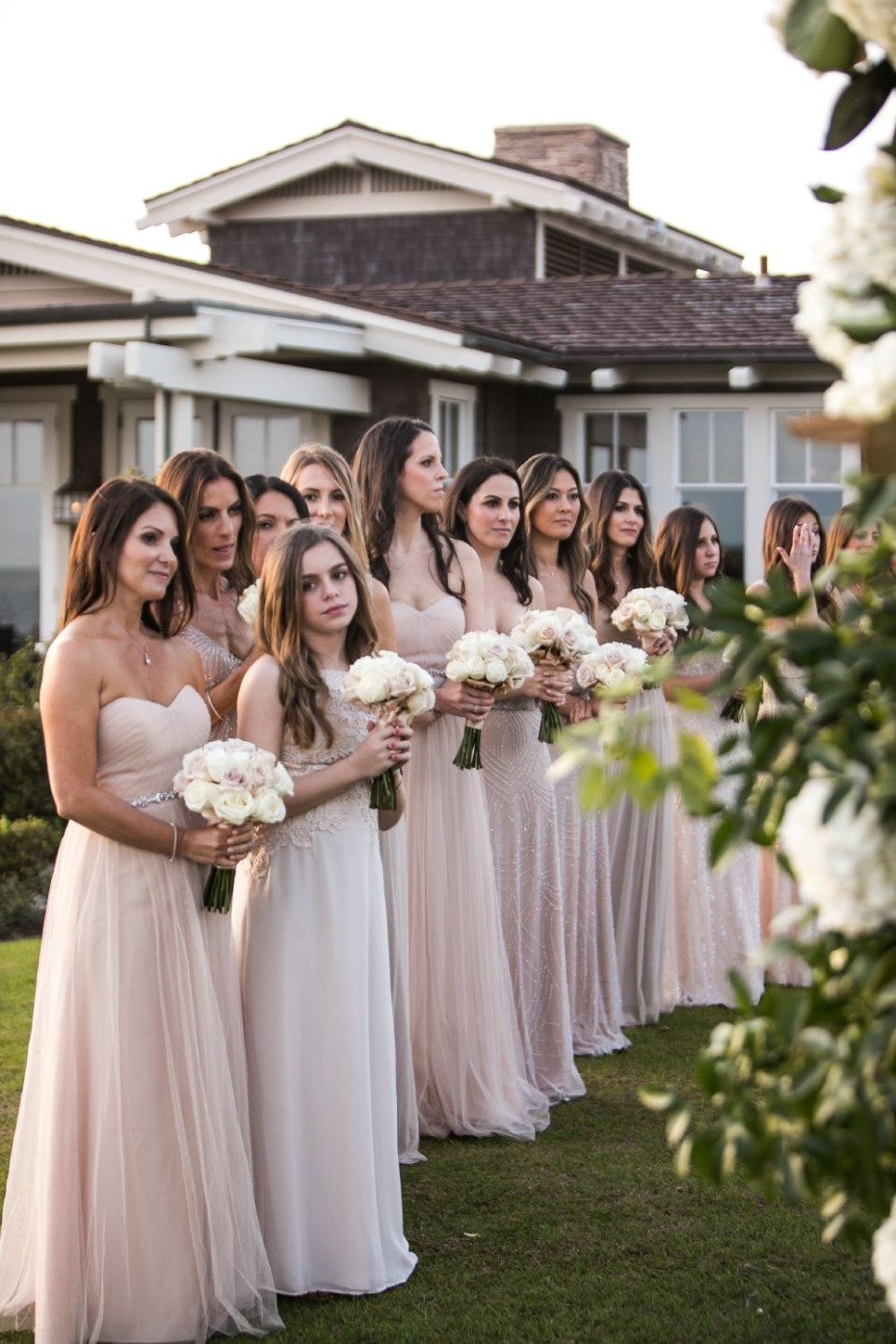 bridesmaids in neutral floor length dresses