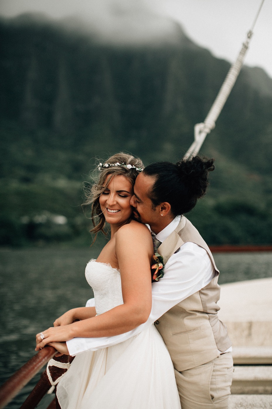 Bride and groom embrace during their mountain wedding