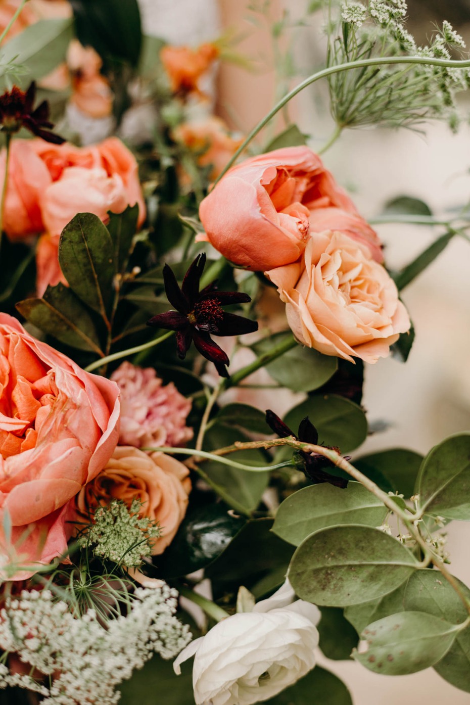 Beautiful bouquet of peach roses and greenery closeup