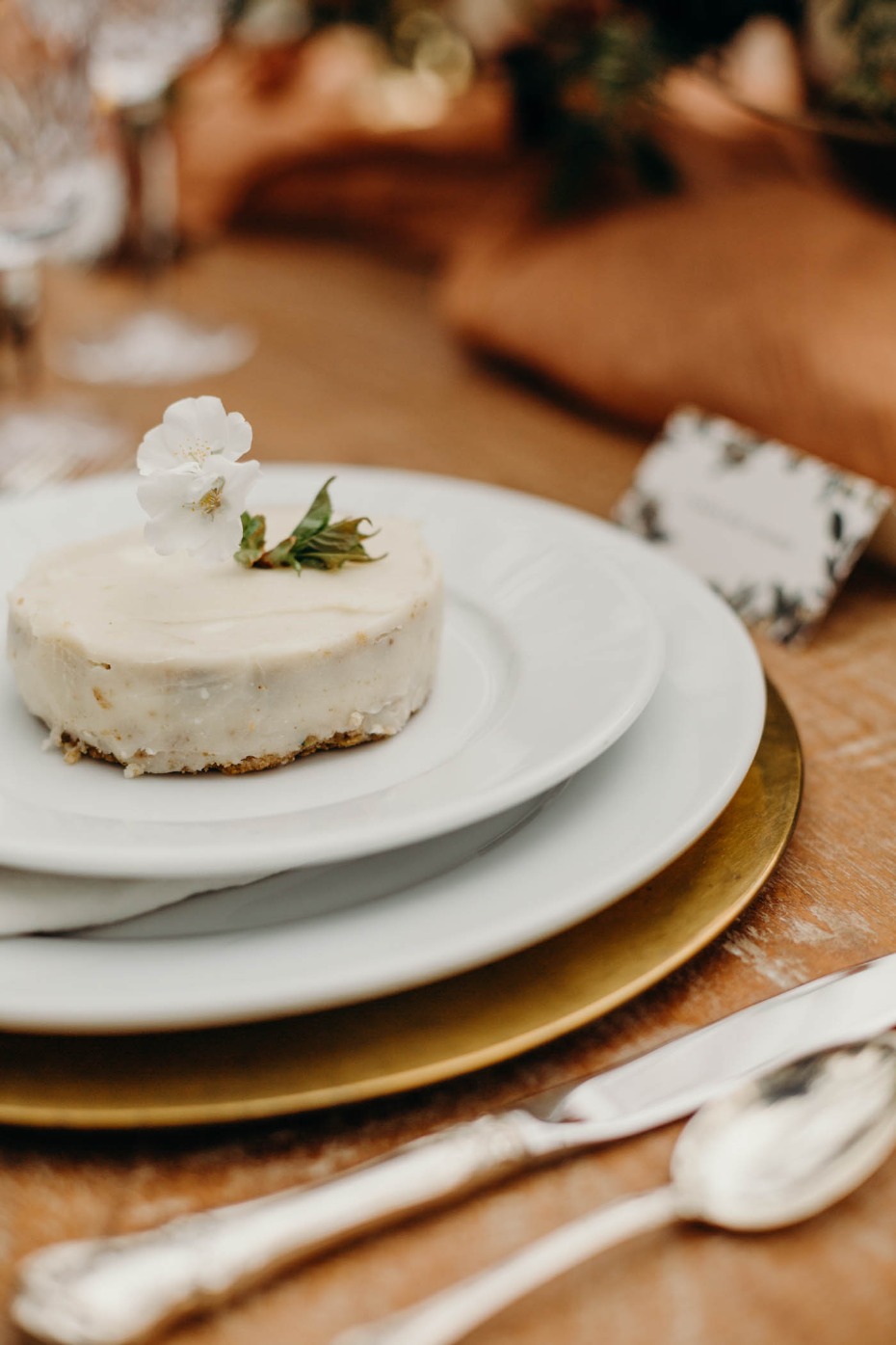 Elegant wedding cake with floral decoration on table