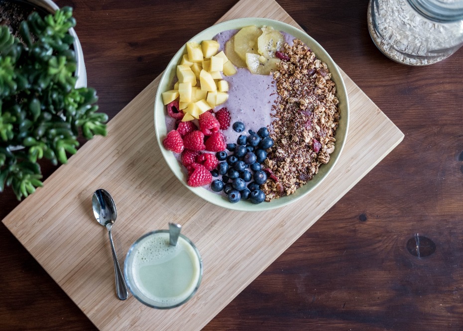 Colorful smoothie bowl with fruit and granola topping