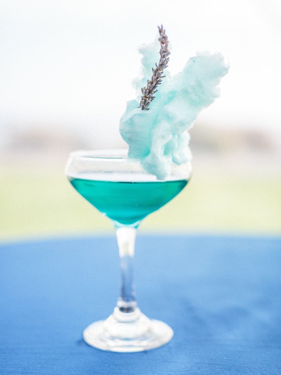 Blue cocktail with cotton candy and lavender