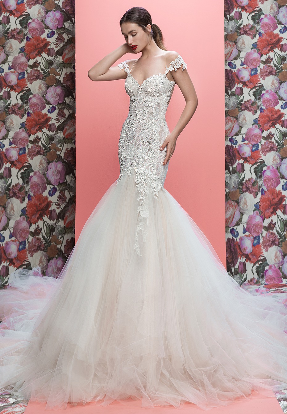 Woman wearing a stunning white lace mermaid wedding dress