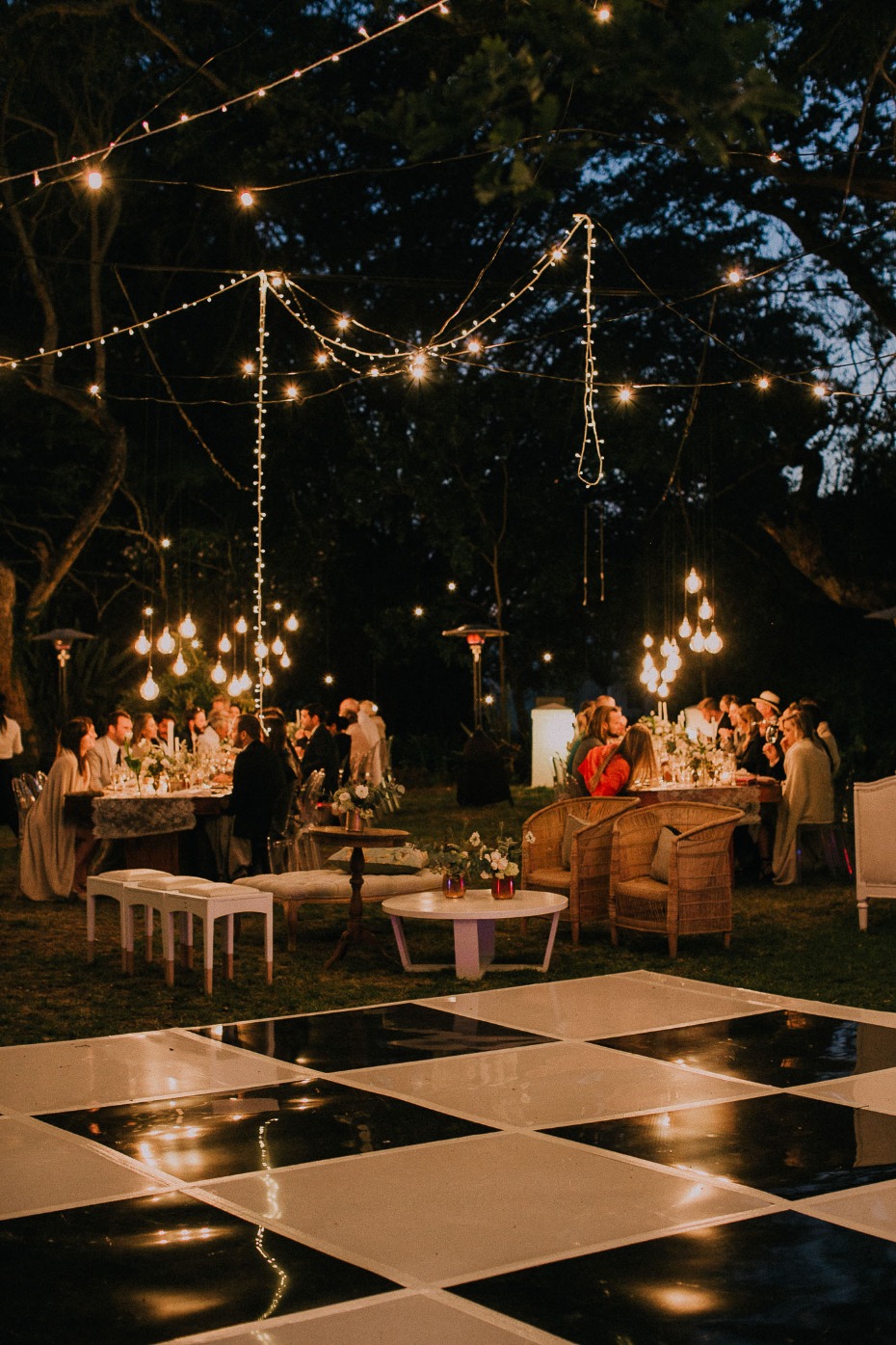 Checkered reception dance floor with hanging lights