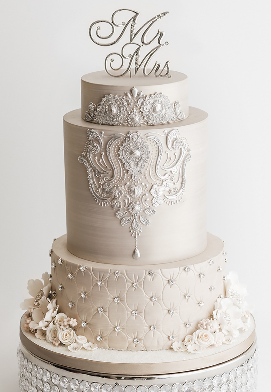 Elegant three tier wedding cake with silver decorations