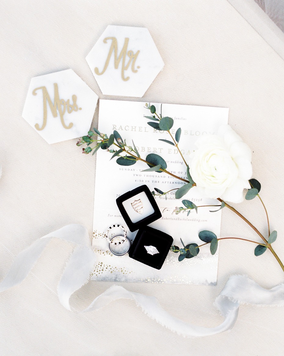 Wedding invitation with rings, Mr and Mrs signs, and flowers