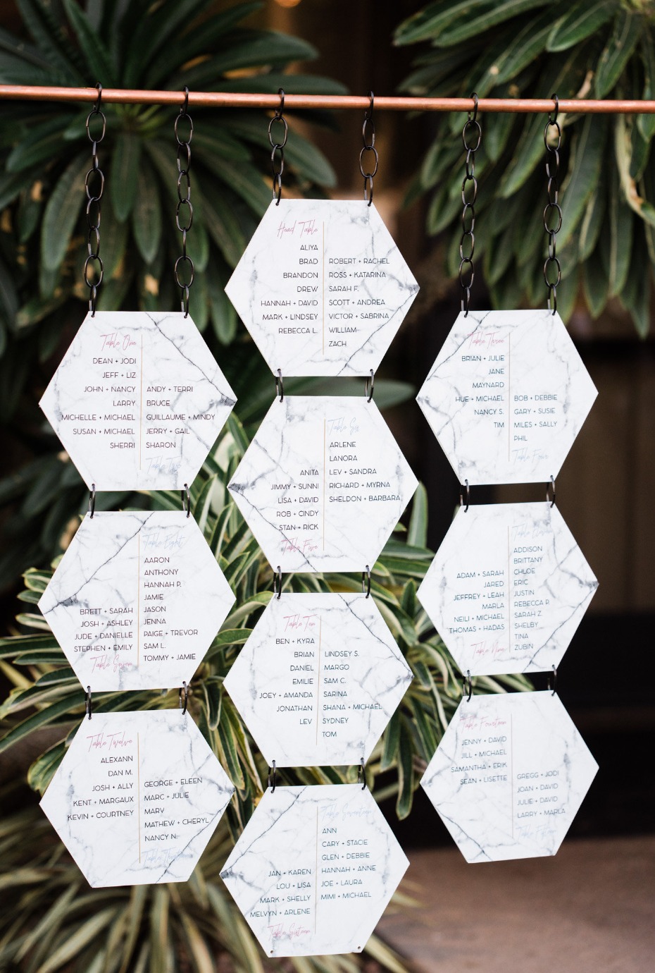 Elegant wedding seating chart with marble hexagon cards