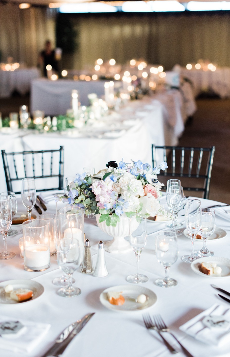 Elegant wedding reception table setting with floral centerpiece