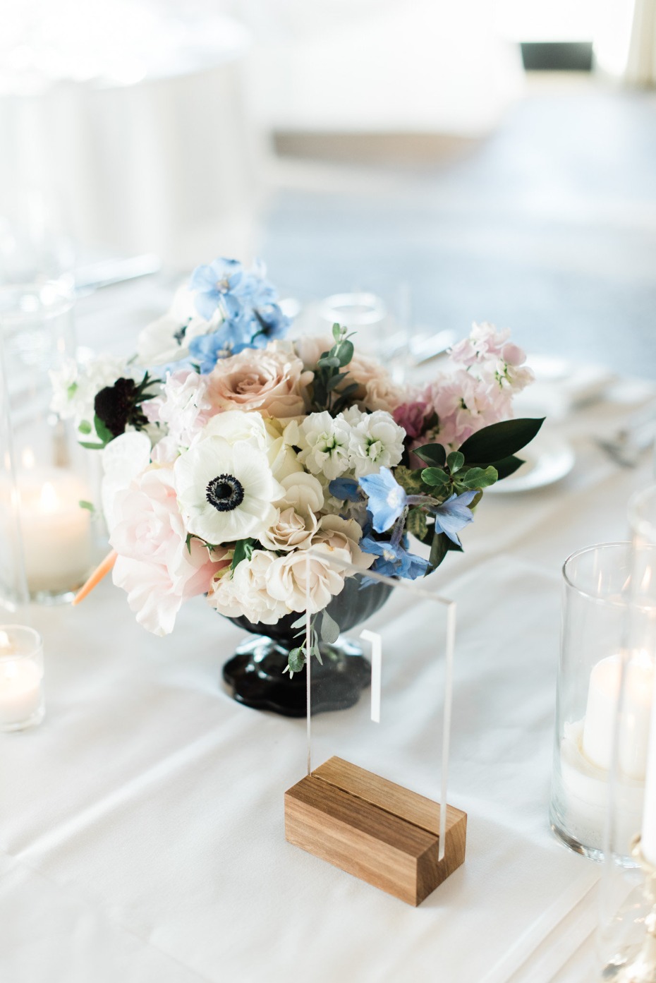Elegant floral centerpiece with a table number setting