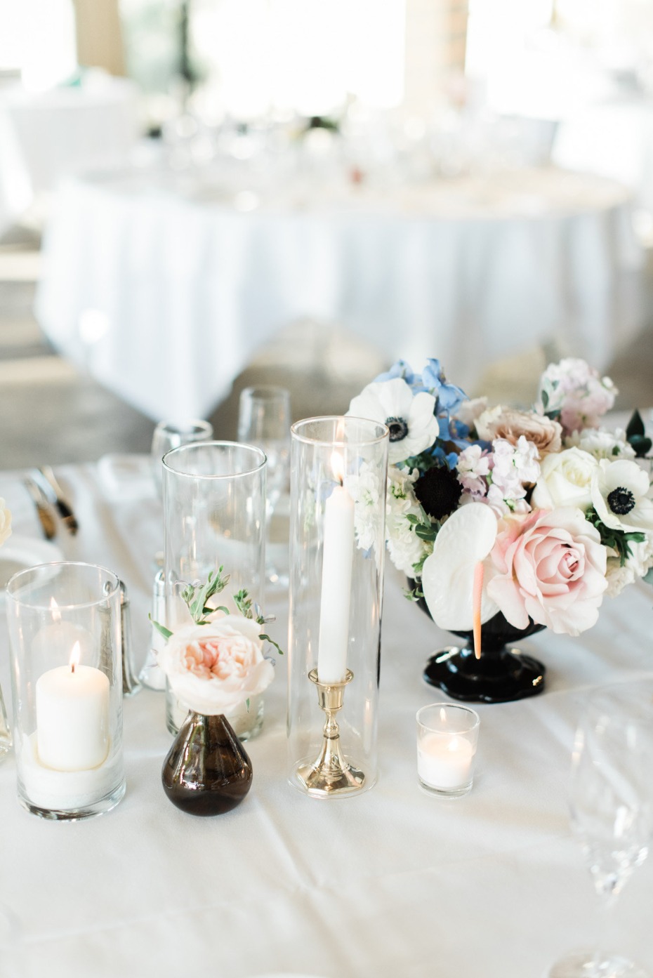 Elegant wedding table with candles and floral centerpiece decor