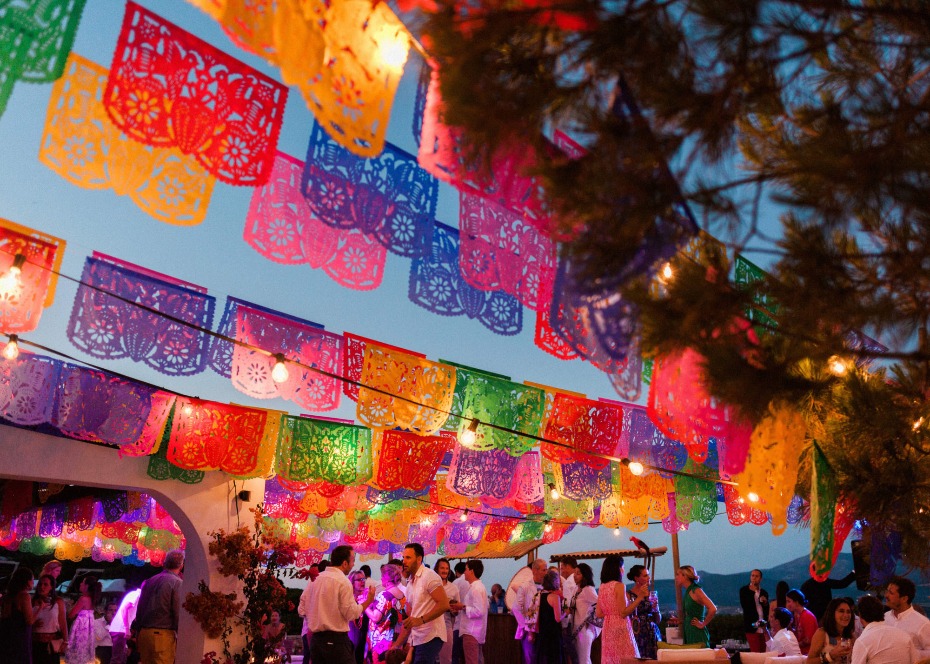 colorful papel picado banners for a pre-wedding fiesta
