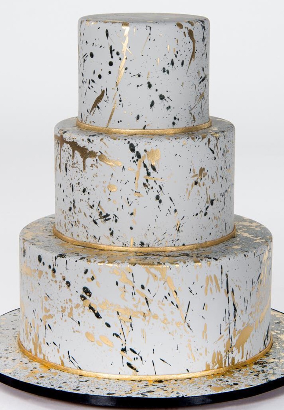 Three tier cake grey with gold black drips