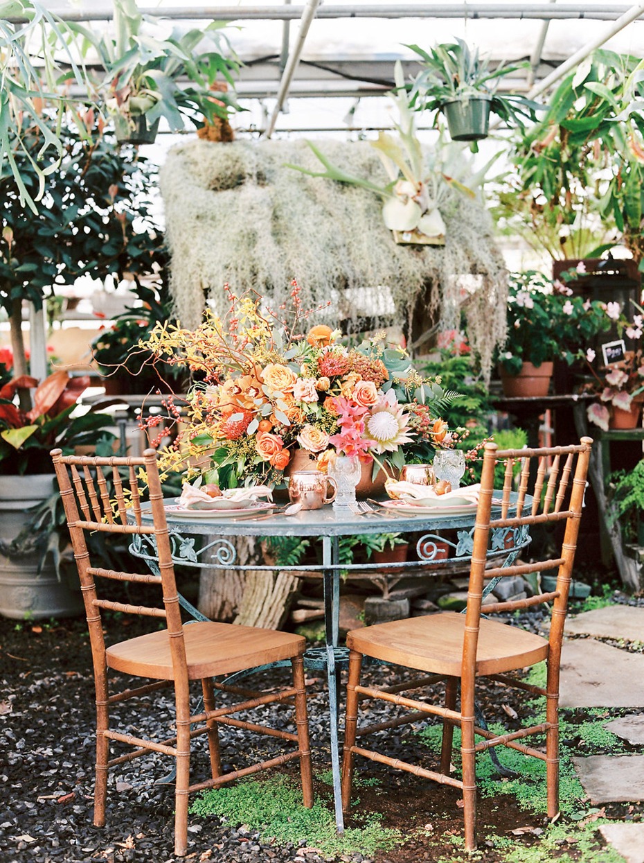Romantic greenhouse setting with floral table display
