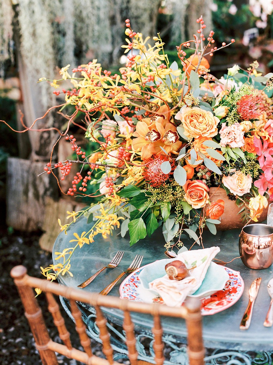 Elegant floral centerpiece at outdoor wedding table