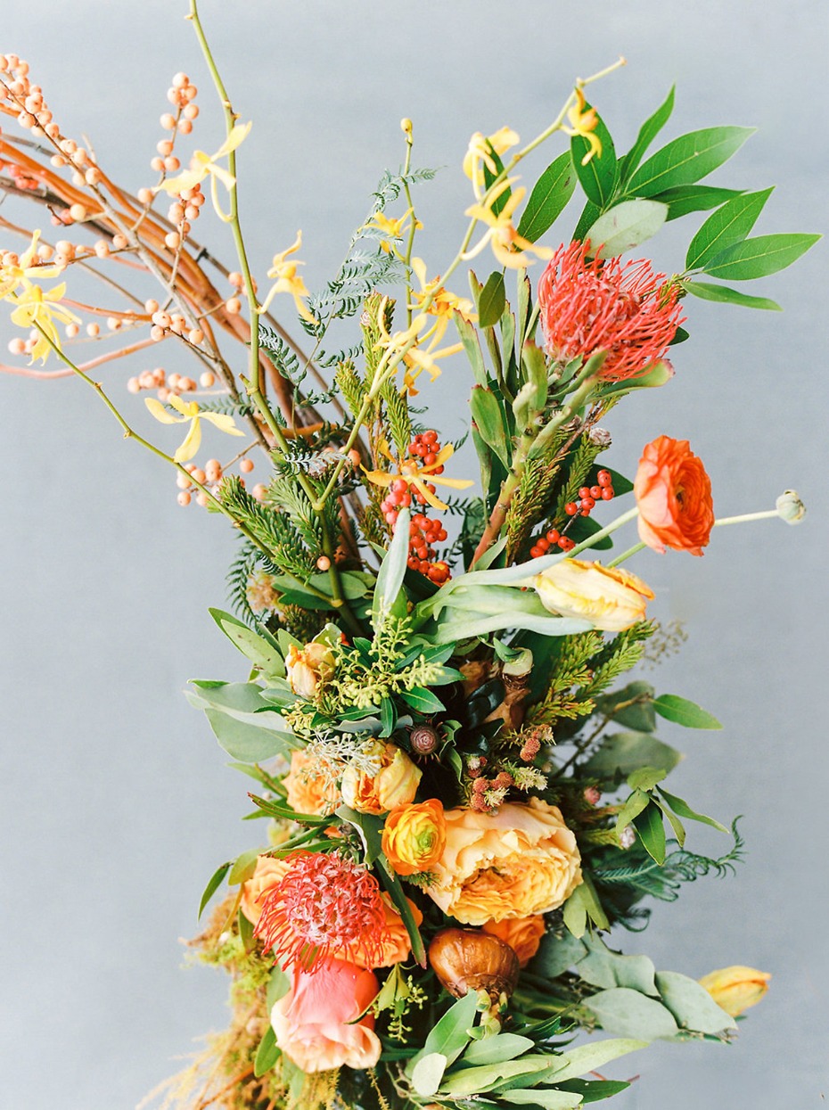 Elegant floral arrangement with protea and ranunculus