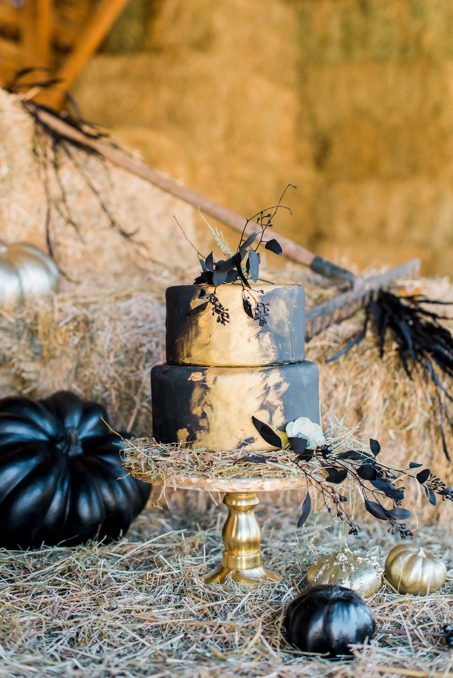 Black and gold Halloween cake with pumpkin decorations