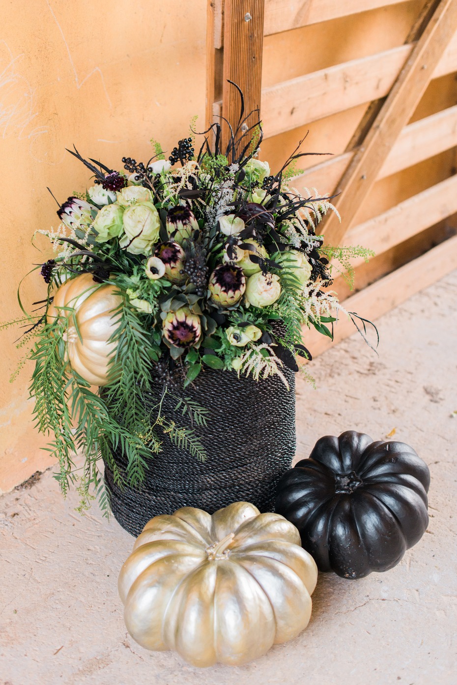 Elegant fall display of pumpkins and floral arrangement