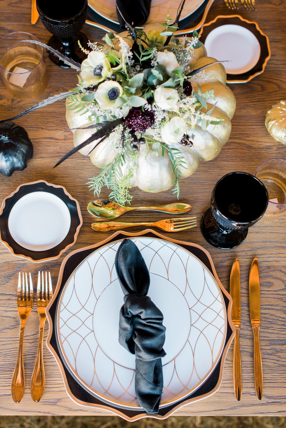 Modern farm table decor in gold, black, and white