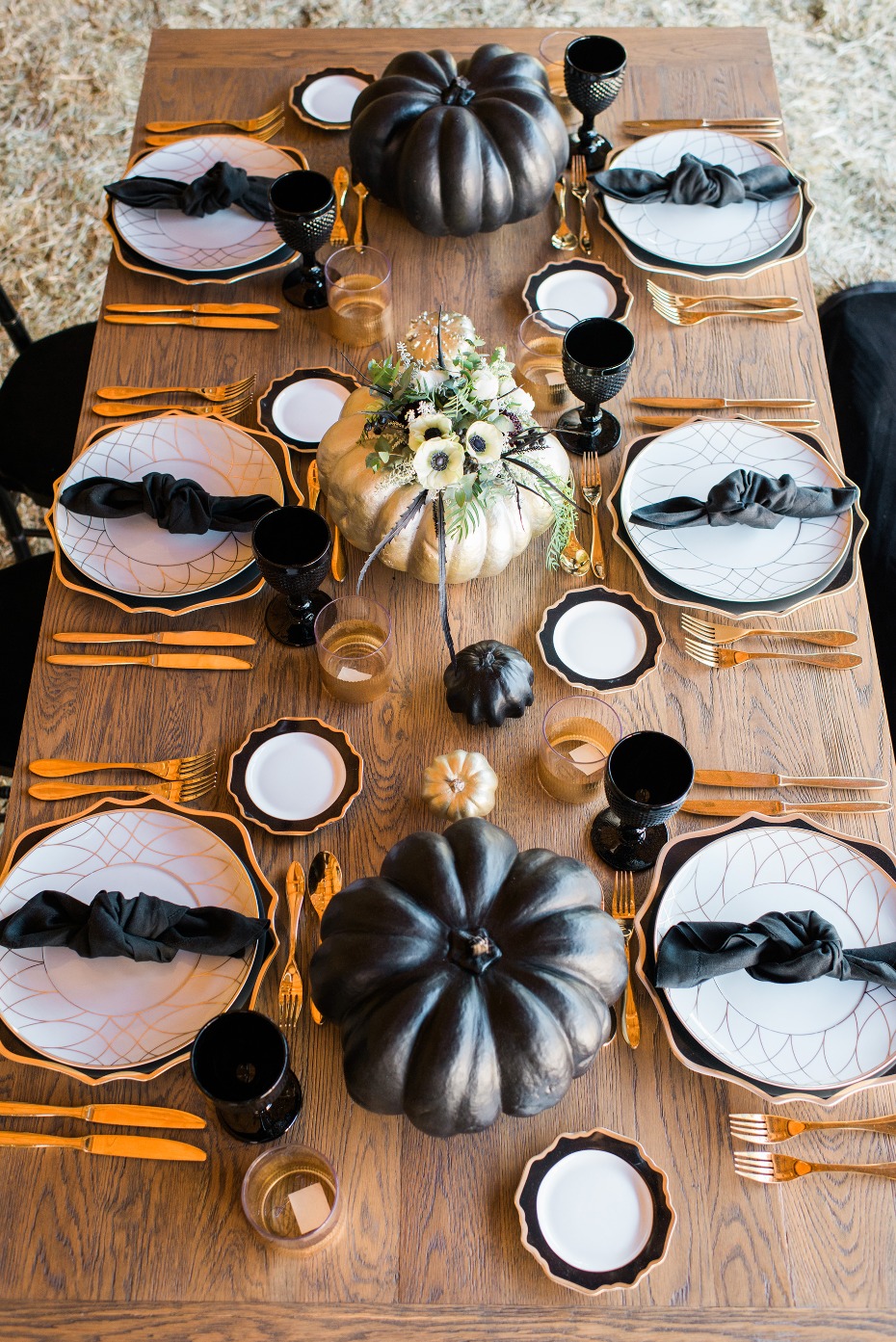 Elegant Halloween table setting with black and gold decor