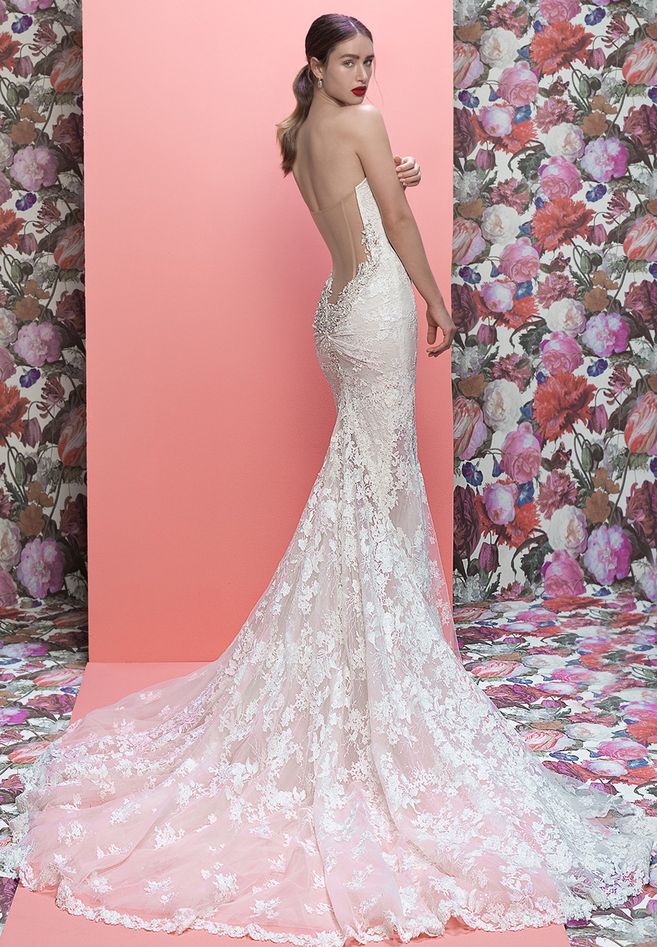 Elegant strapless lace wedding dress with flowing train