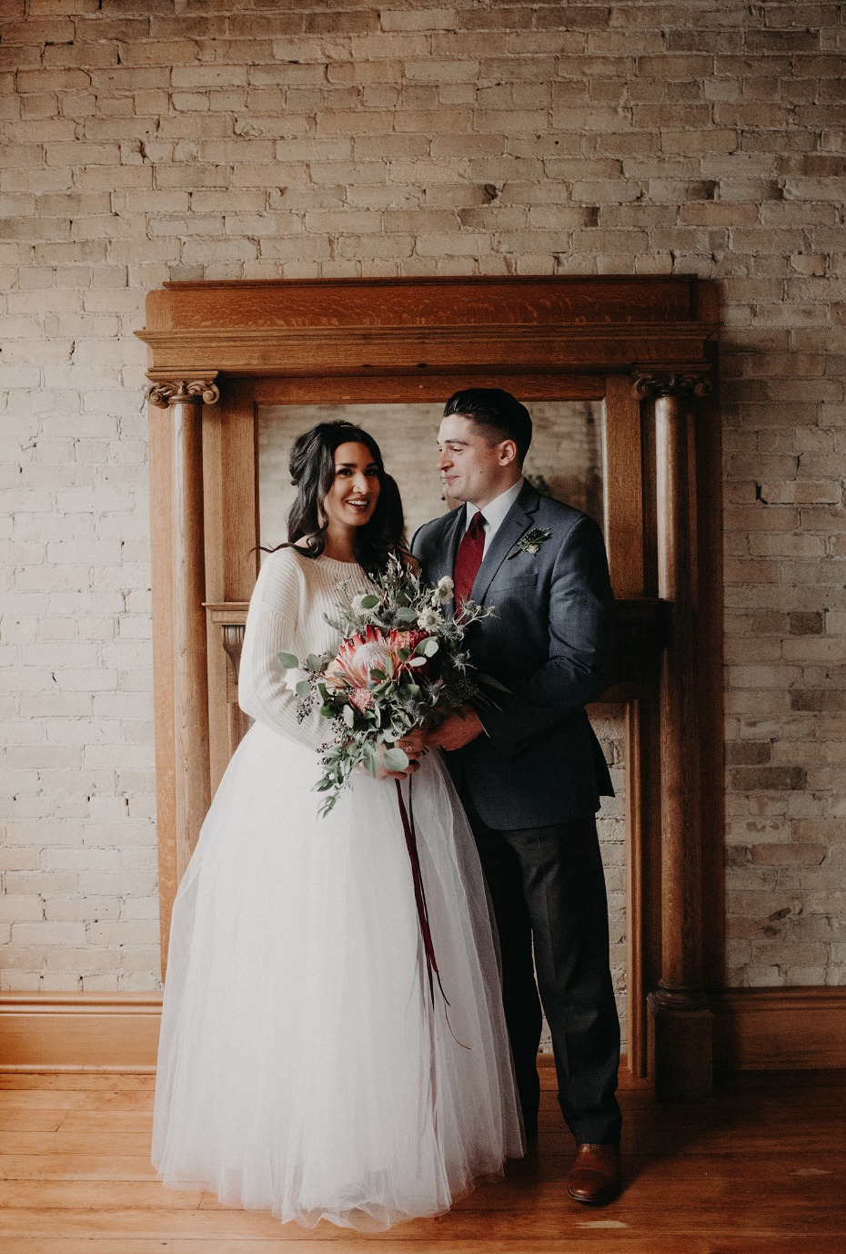 Happy bride and groom smiling at their wedding ceremony