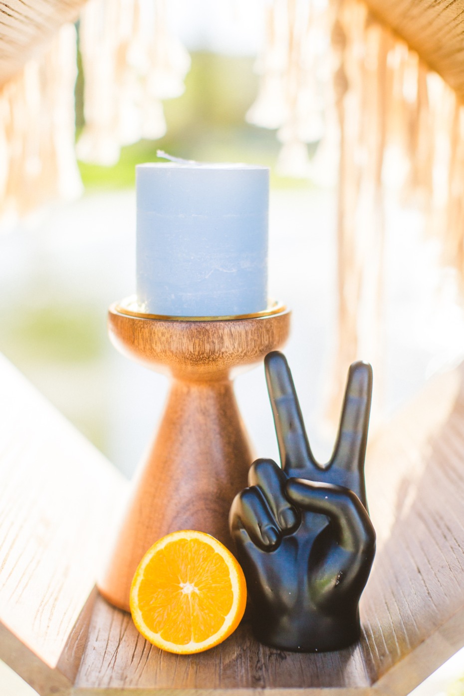 Blue candle peace sign and orange still life decor