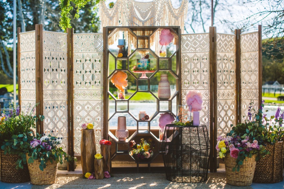 Boho wedding backdrop with macrame and floral decor
