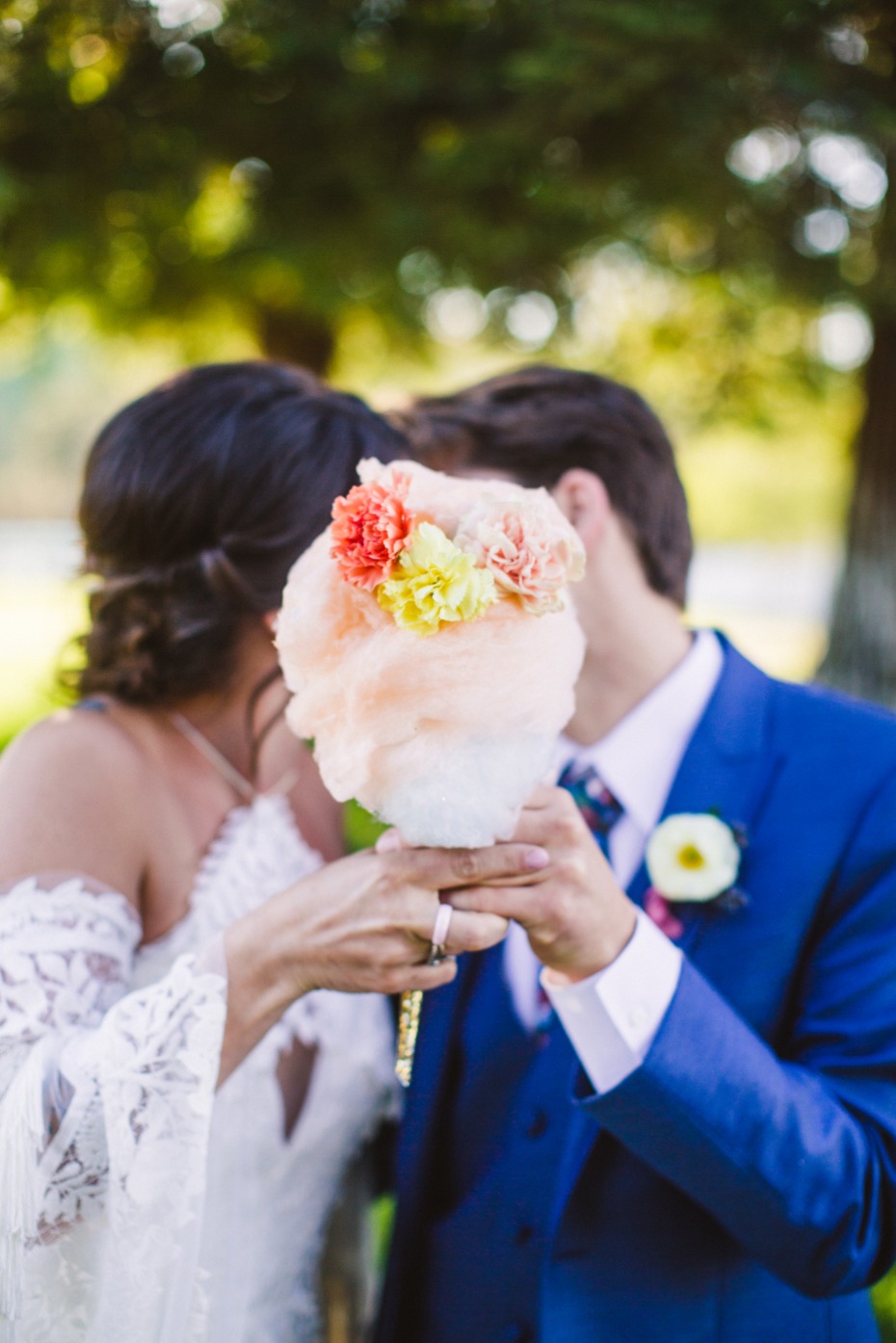 Bride and groom with flower decorated cotton candy