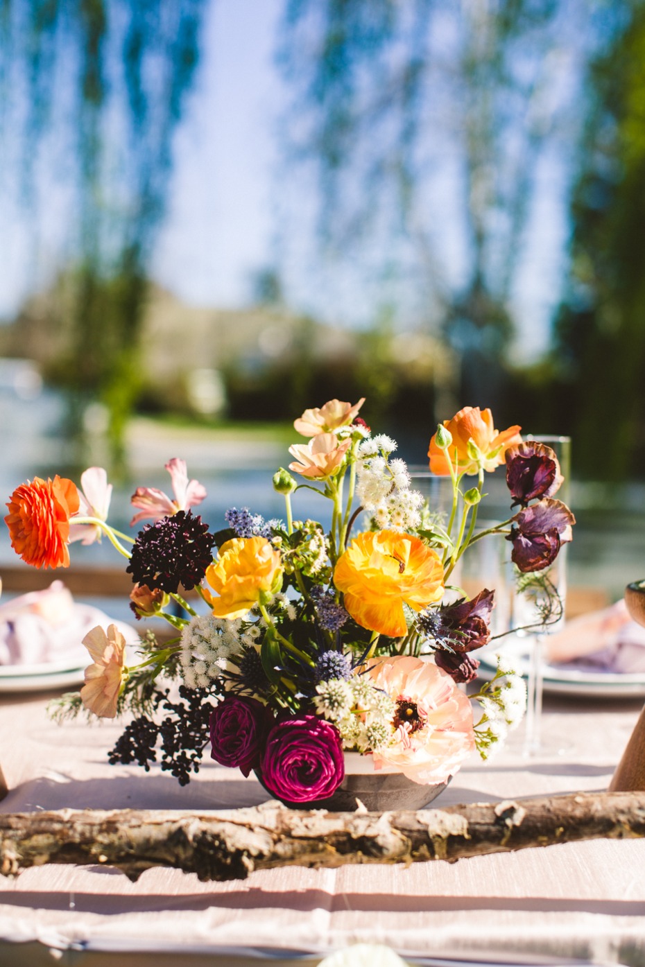 Vibrant floral centerpiece for rustic wedding