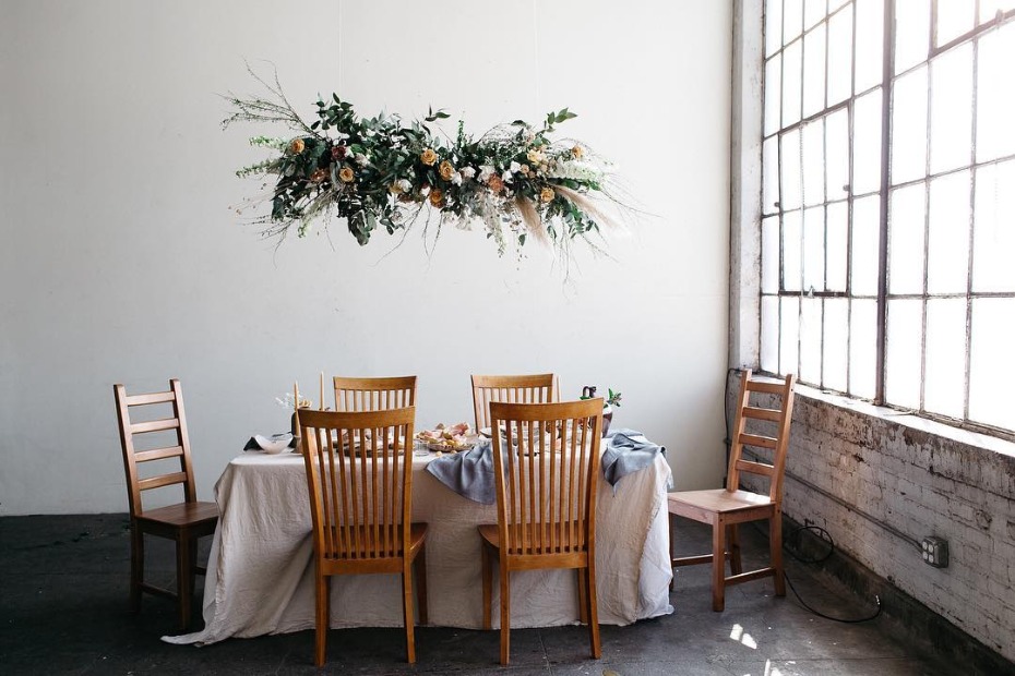 Elegant floral centerpiece above dining table indoors