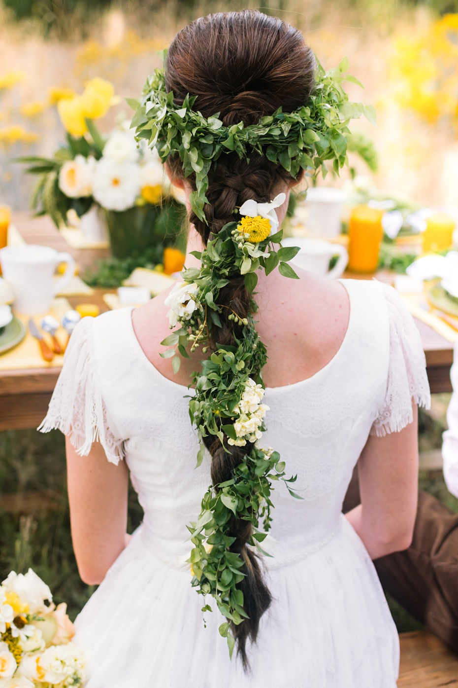 Bride with floral braided hairstyle at wedding reception