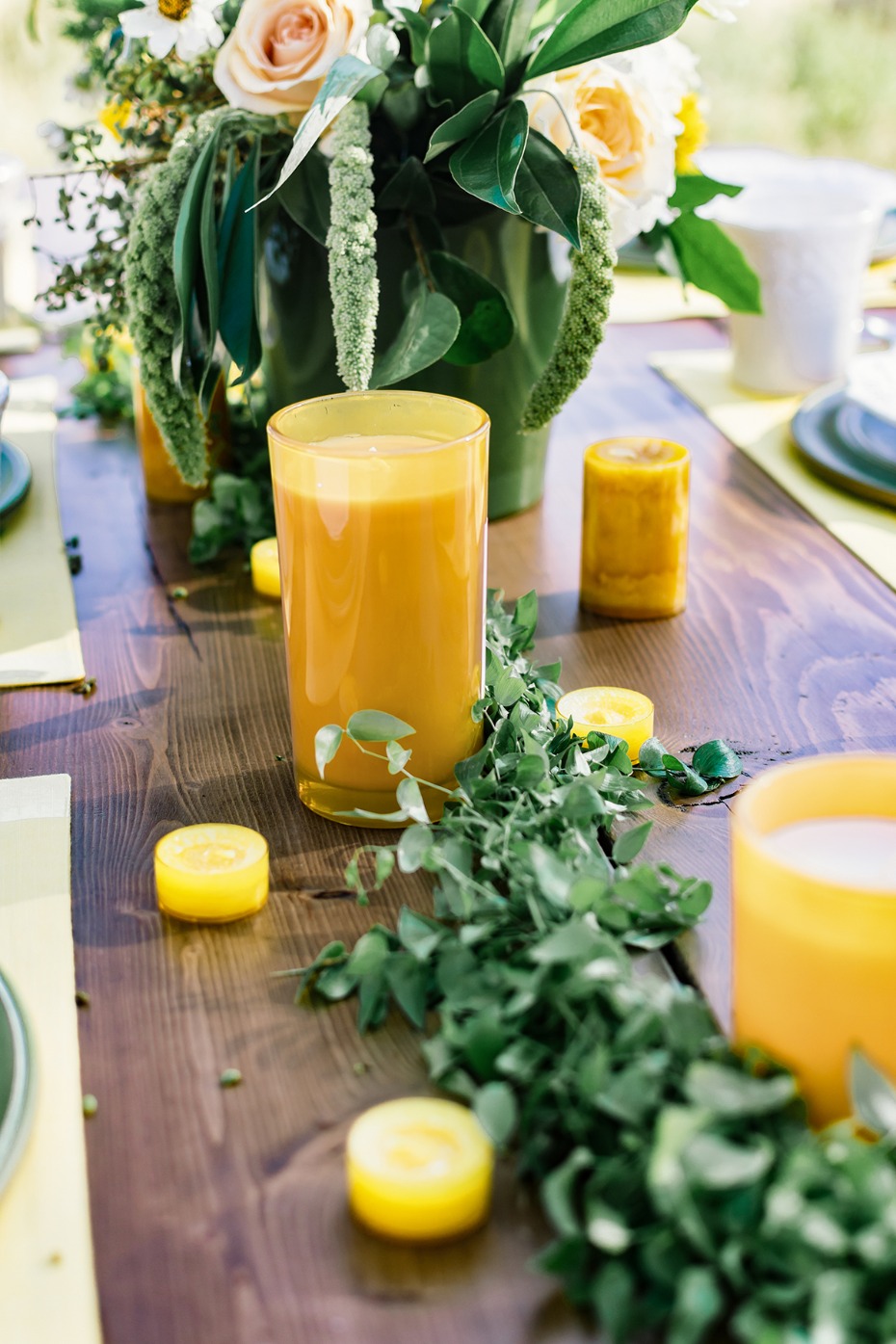 Rustic wedding table setting with flowers and candles