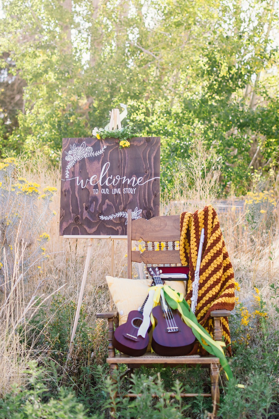 Rustic wedding decor with guitars and welcome sign