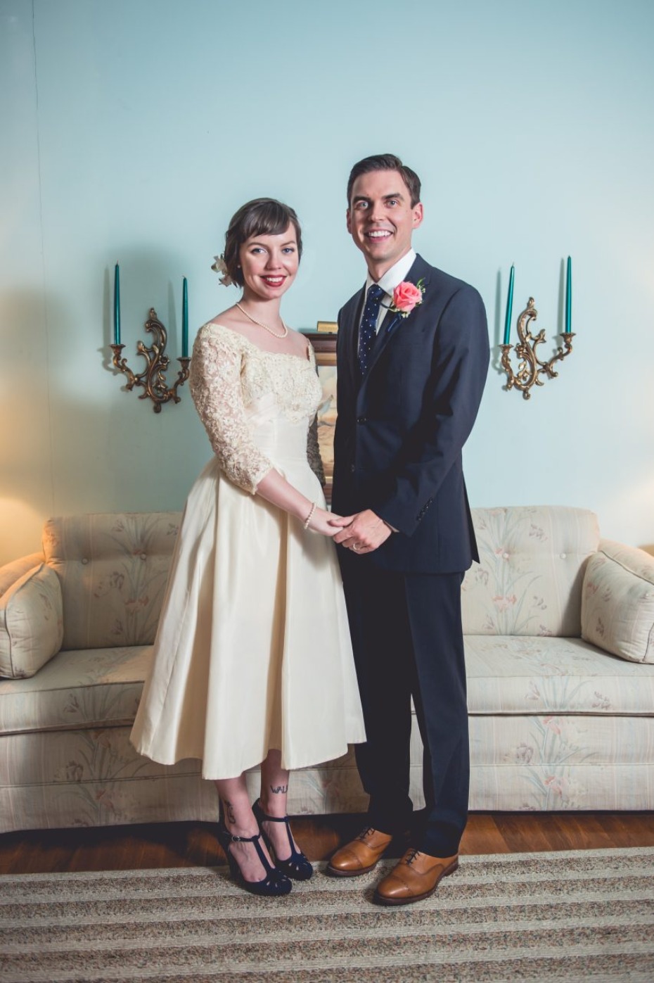 Bride and groom hold hands vintage wedding portrait