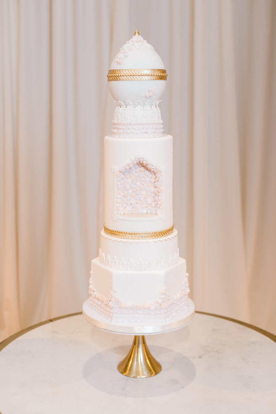 Faberge egg inspired wedding cake in gold and white
