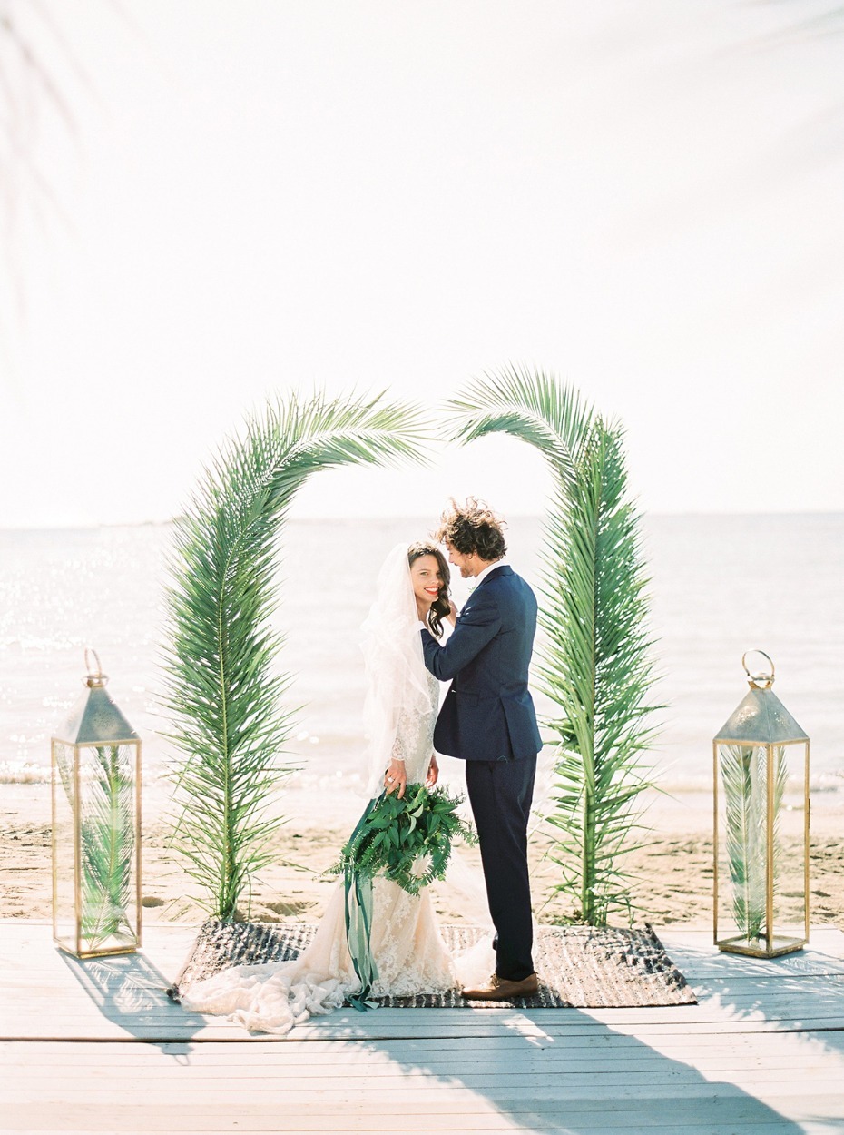 Palm frond wedding arbor