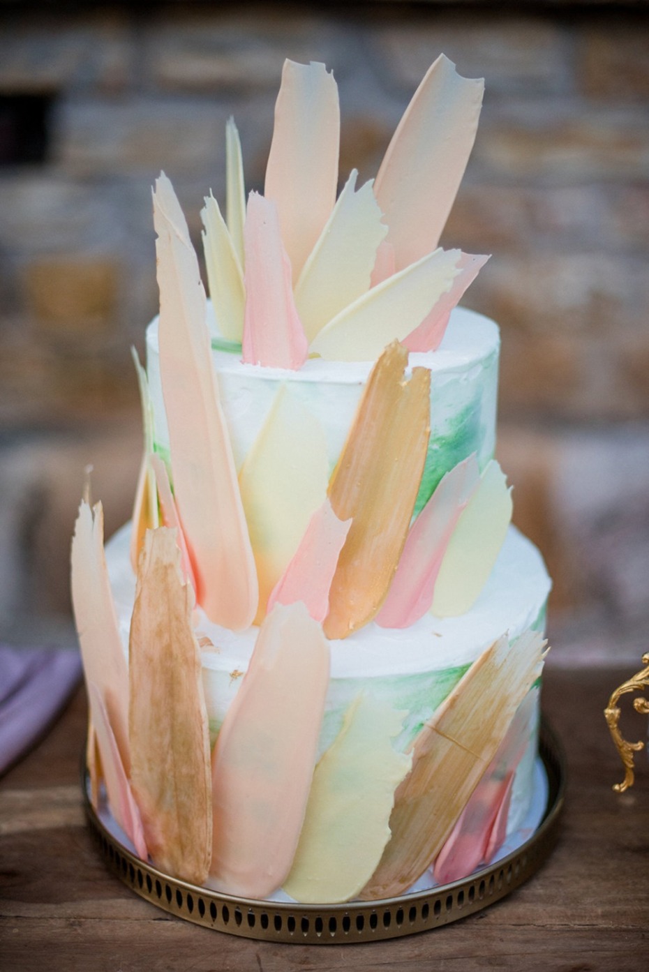 Elegant two tier cake with pastel chocolate accents