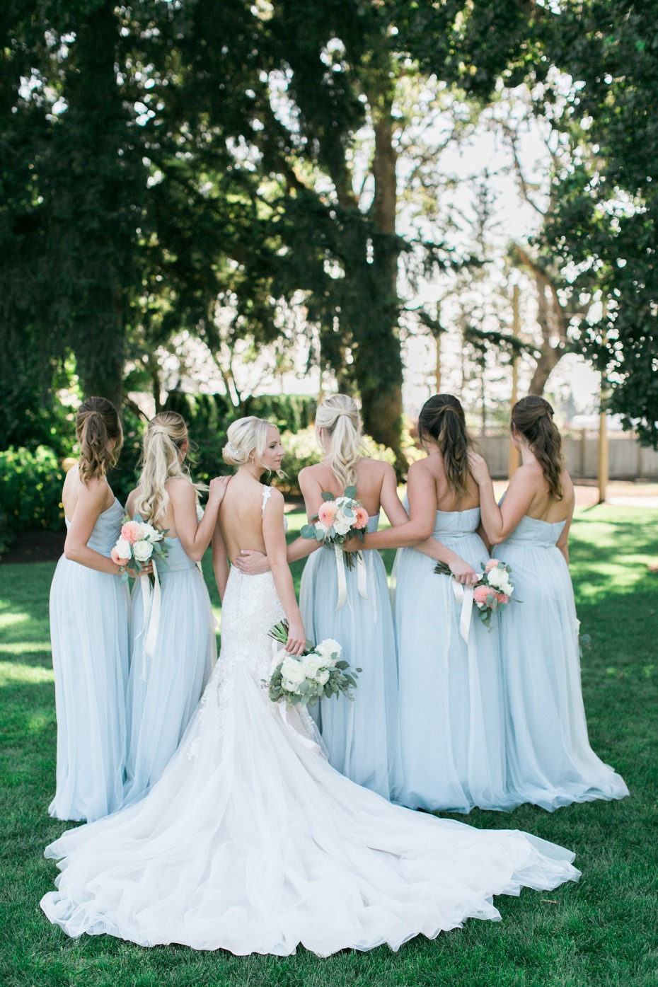 Bridesmaids in matching blue gowns