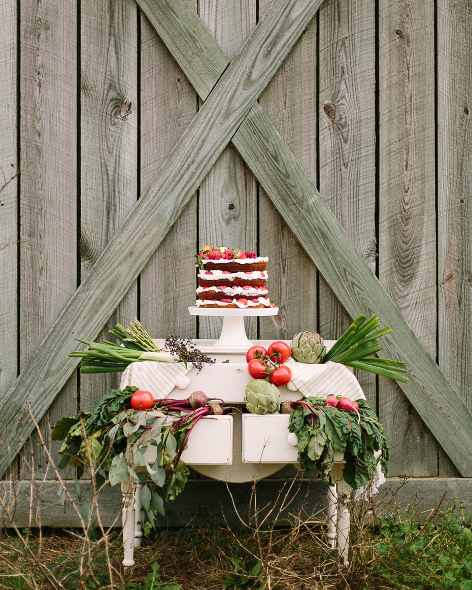 Rustic naked cake with garden vegetables display