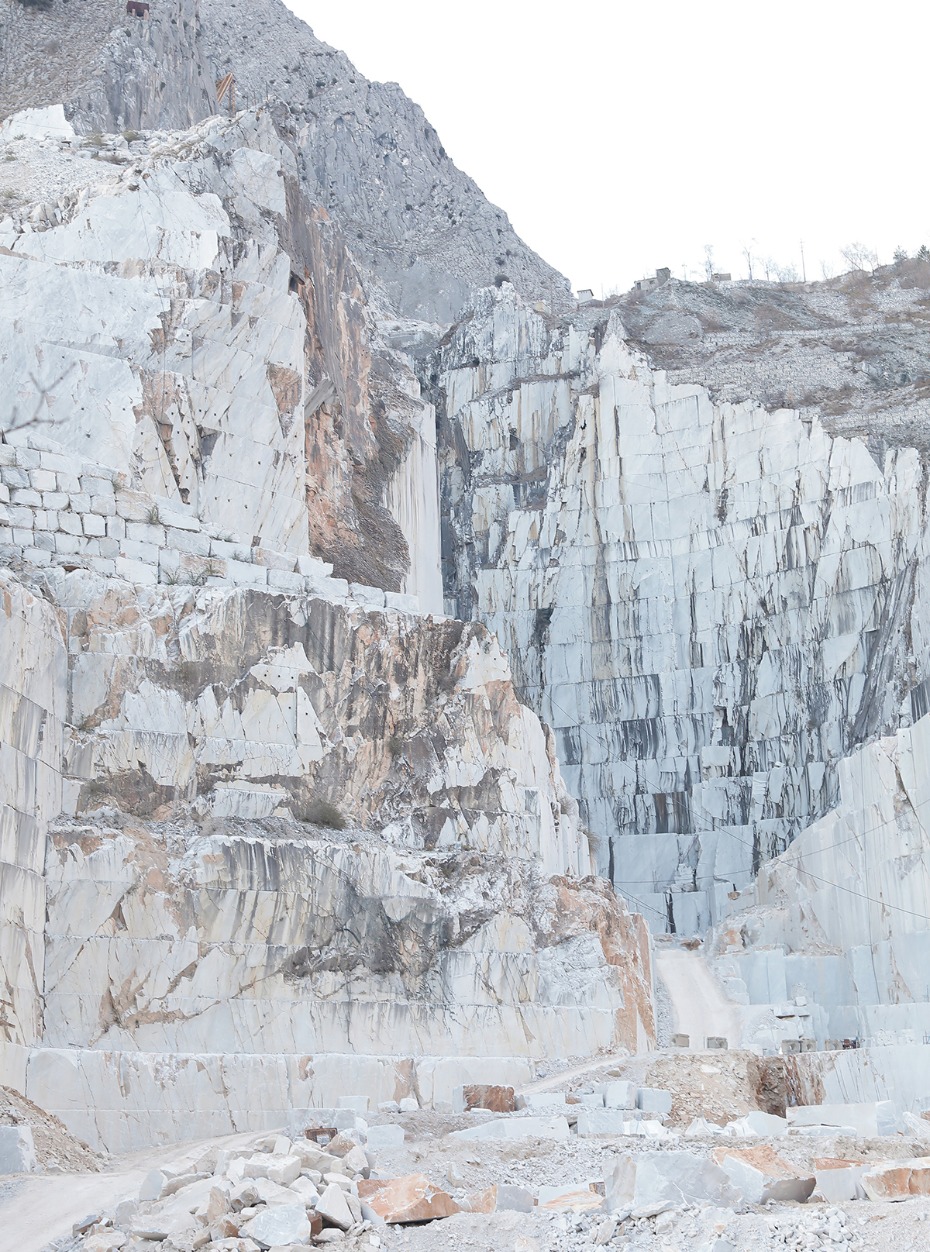 Marble quarry in mountain landscape with stacked blocks