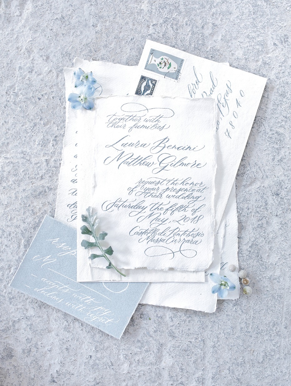 Elegant wedding invitation suite with calligraphy details