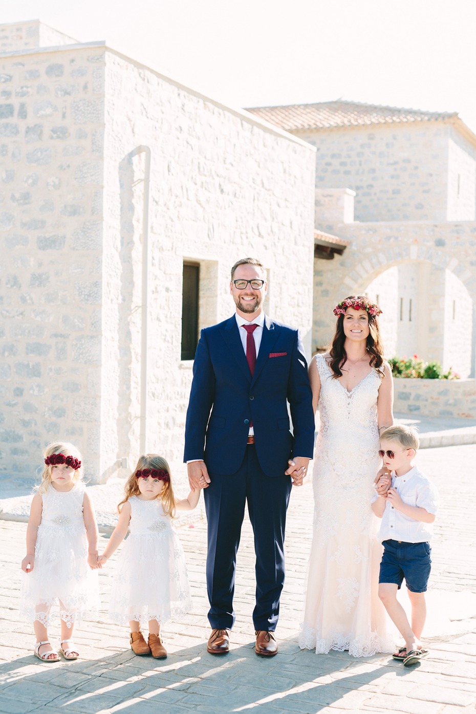 bride groom and their flower girls and ring bearer