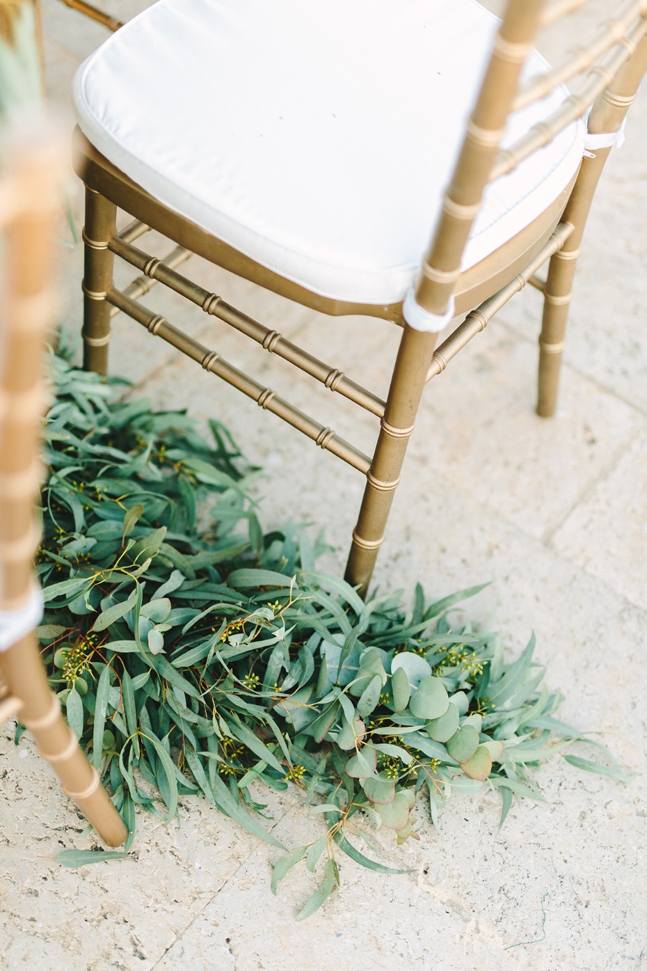 gold chairs and greenery decor