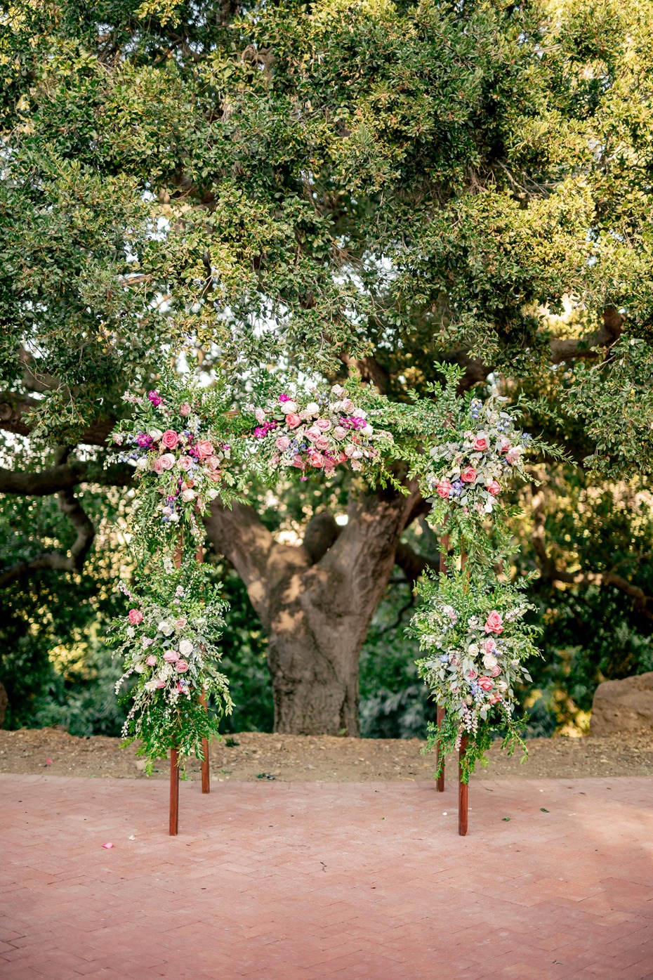 floral draped wedding arch