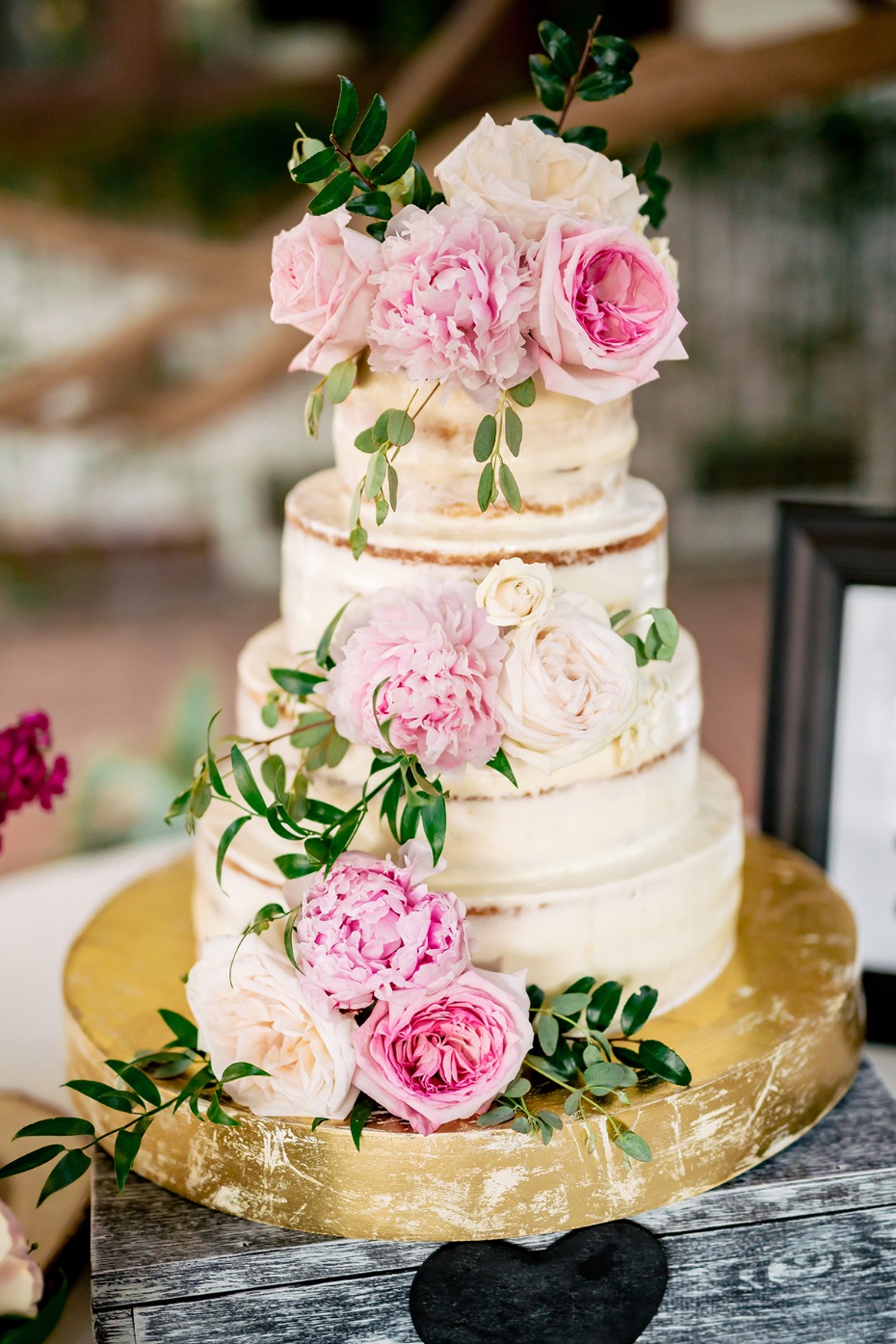soft pink floral topped wedding cake