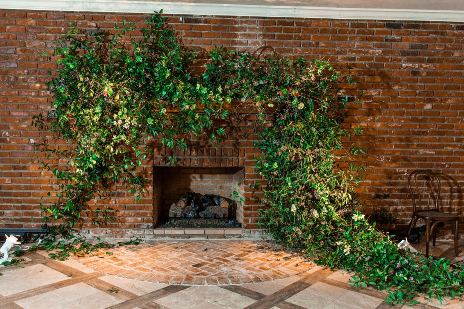 overgrown fireplace wedding ceremony backdrop idea