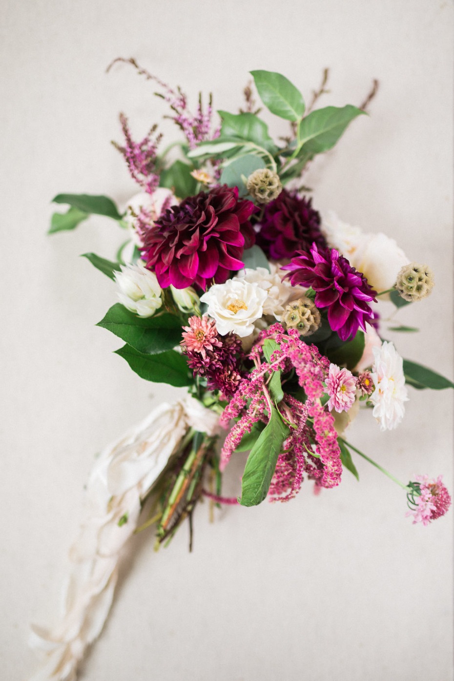 Burgundy dahlia flower bouquet tied with a silk ribbon