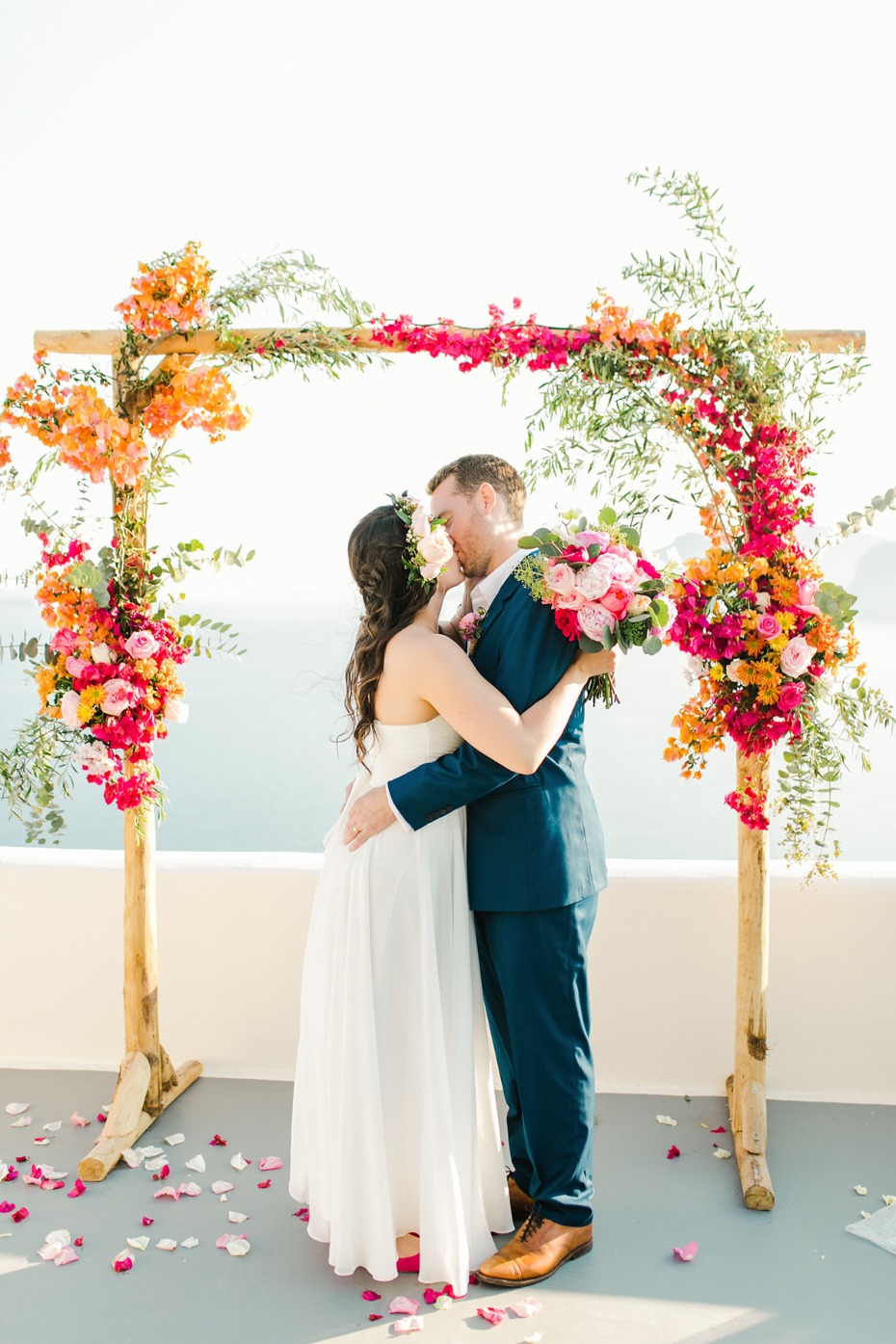 orange and pink floral wedding arch