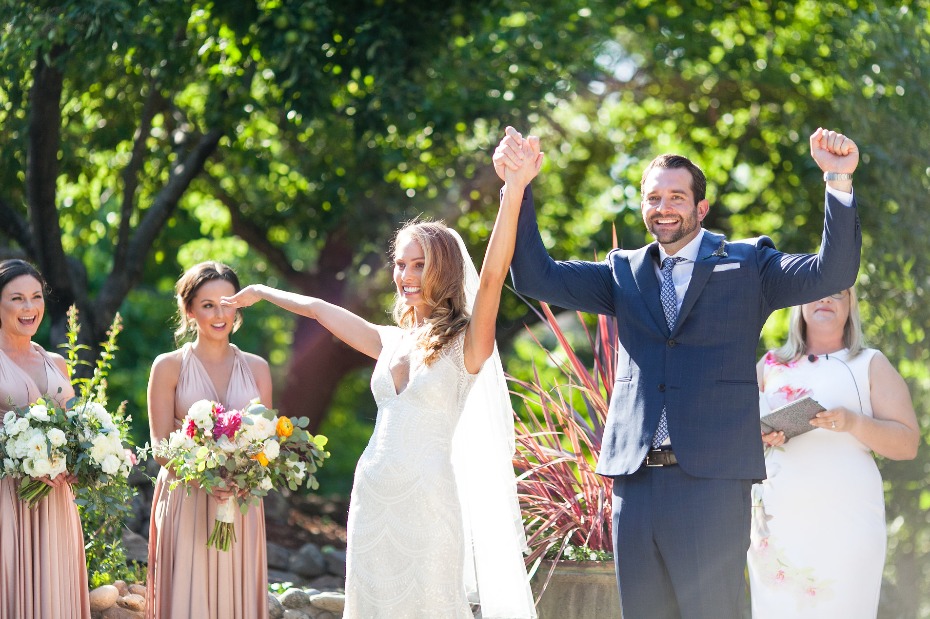 Newlyweds celebrate their joyful wedding ceremony outdoors